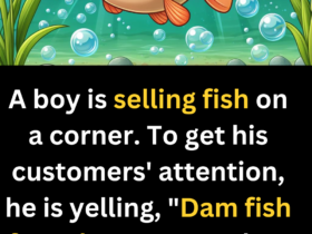 A boy is selling fish on a corner